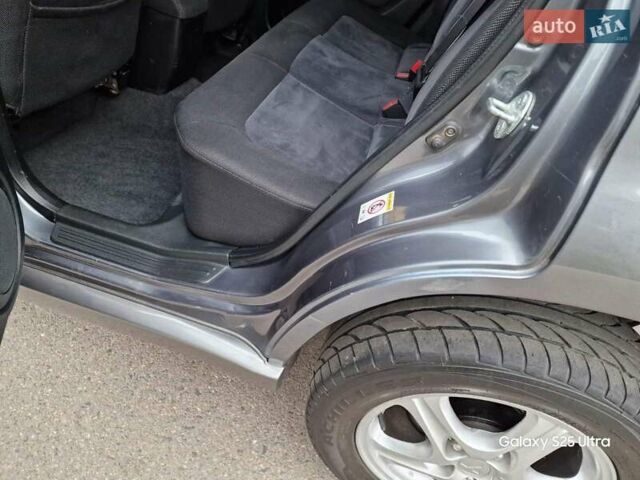 Серый Мицубиси Аутлендер, объемом двигателя 2 л и пробегом 240 тыс. км за 6300 $, фото 10 на Automoto.ua