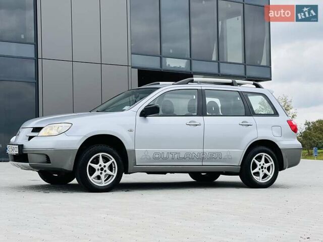 Сірий Міцубісі Аутлендер, об'ємом двигуна 2 л та пробігом 300 тис. км за 5150 $, фото 1 на Automoto.ua