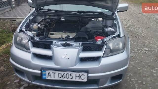 Серый Мицубиси Аутлендер, объемом двигателя 2.4 л и пробегом 261 тыс. км за 5700 $, фото 4 на Automoto.ua