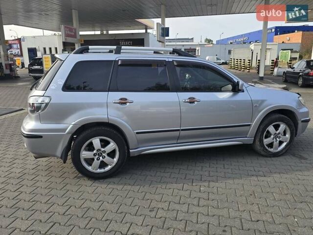 Серый Мицубиси Аутлендер, объемом двигателя 2.4 л и пробегом 243 тыс. км за 6999 $, фото 20 на Automoto.ua