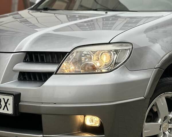 Сірий Міцубісі Аутлендер, об'ємом двигуна 2.4 л та пробігом 98 тис. км за 7199 $, фото 5 на Automoto.ua