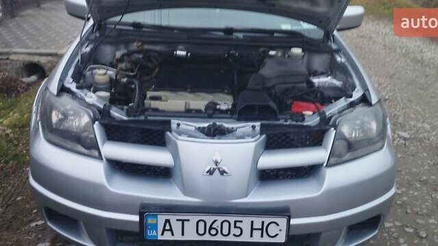 Серый Мицубиси Аутлендер, объемом двигателя 2.4 л и пробегом 261 тыс. км за 5700 $, фото 6 на Automoto.ua