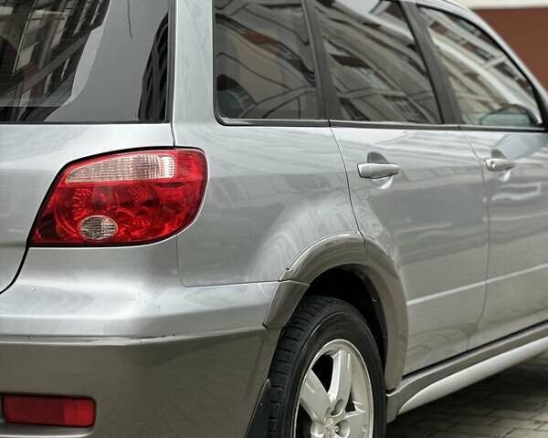 Сірий Міцубісі Аутлендер, об'ємом двигуна 2.4 л та пробігом 98 тис. км за 7199 $, фото 47 на Automoto.ua