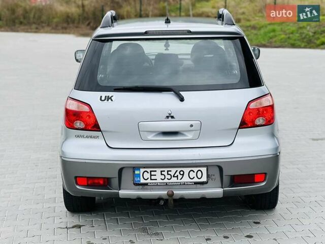 Сірий Міцубісі Аутлендер, об'ємом двигуна 2 л та пробігом 300 тис. км за 5650 $, фото 11 на Automoto.ua