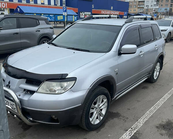 Серый Мицубиси Аутлендер, объемом двигателя 2.4 л и пробегом 307 тыс. км за 4000 $, фото 2 на Automoto.ua