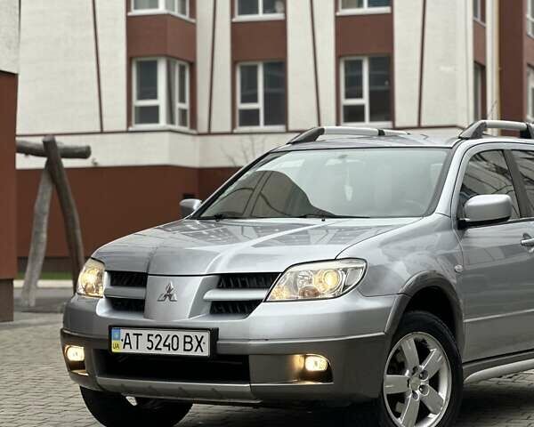Сірий Міцубісі Аутлендер, об'ємом двигуна 2.4 л та пробігом 98 тис. км за 7199 $, фото 1 на Automoto.ua