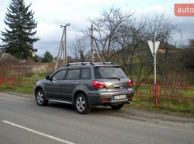 Серый Мицубиси Аутлендер, объемом двигателя 2.4 л и пробегом 235 тыс. км за 6500 $, фото 5 на Automoto.ua