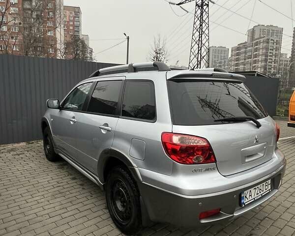 Серый Мицубиси Аутлендер, объемом двигателя 2.4 л и пробегом 179 тыс. км за 7000 $, фото 4 на Automoto.ua