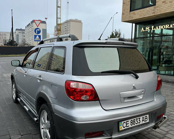 Серый Мицубиси Аутлендер, объемом двигателя 2.38 л и пробегом 180 тыс. км за 6000 $, фото 12 на Automoto.ua