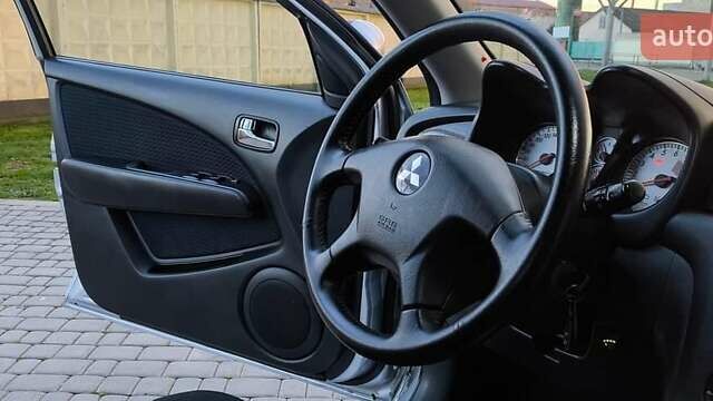 Серый Мицубиси Аутлендер, объемом двигателя 2.38 л и пробегом 228 тыс. км за 7900 $, фото 11 на Automoto.ua