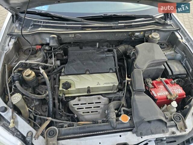 Серый Мицубиси Аутлендер, объемом двигателя 2.4 л и пробегом 243 тыс. км за 6999 $, фото 7 на Automoto.ua