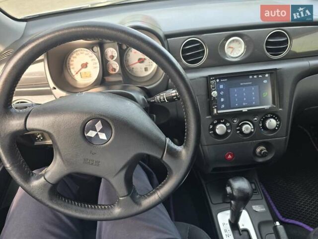 Серый Мицубиси Аутлендер, объемом двигателя 2.4 л и пробегом 243 тыс. км за 6999 $, фото 4 на Automoto.ua