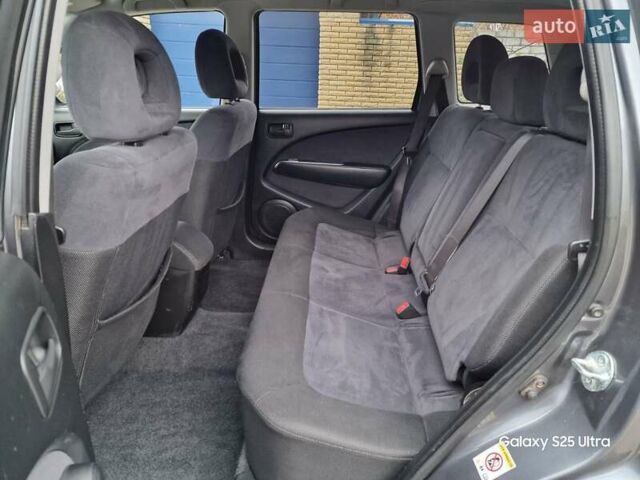 Серый Мицубиси Аутлендер, объемом двигателя 2 л и пробегом 240 тыс. км за 6300 $, фото 9 на Automoto.ua