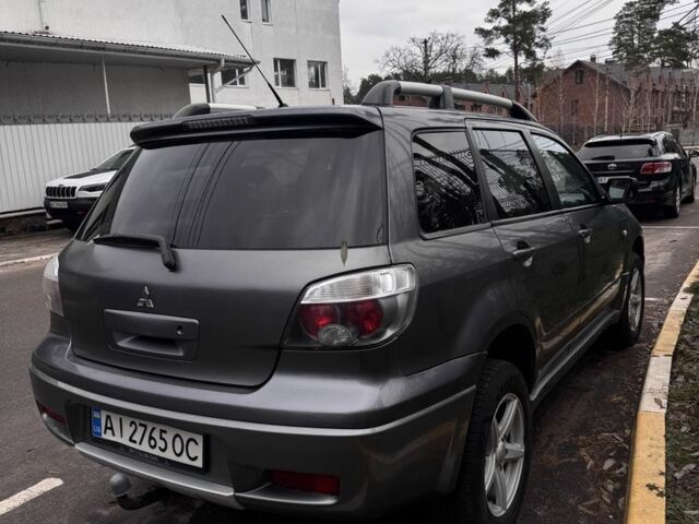 Сірий Міцубісі Аутлендер, об'ємом двигуна 2 л та пробігом 310 тис. км за 5200 $, фото 1 на Automoto.ua