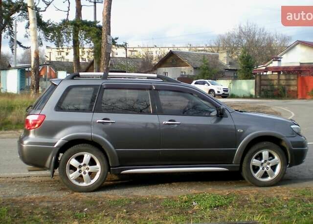Серый Мицубиси Аутлендер, объемом двигателя 2.4 л и пробегом 235 тыс. км за 6500 $, фото 10 на Automoto.ua