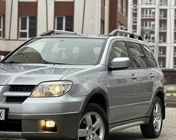 Сірий Міцубісі Аутлендер, об'ємом двигуна 2.4 л та пробігом 98 тис. км за 7199 $, фото 2 на Automoto.ua