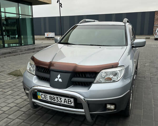 Серый Мицубиси Аутлендер, объемом двигателя 2.38 л и пробегом 180 тыс. км за 6000 $, фото 15 на Automoto.ua
