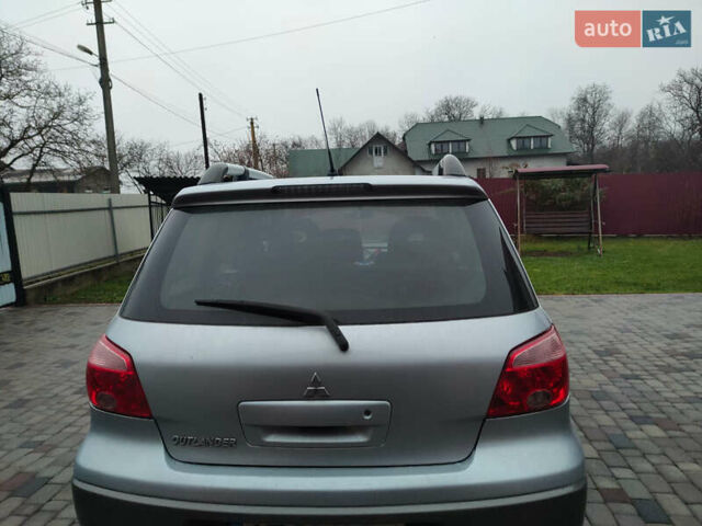 Сірий Міцубісі Аутлендер, об'ємом двигуна 2.4 л та пробігом 98 тис. км за 6800 $, фото 1 на Automoto.ua