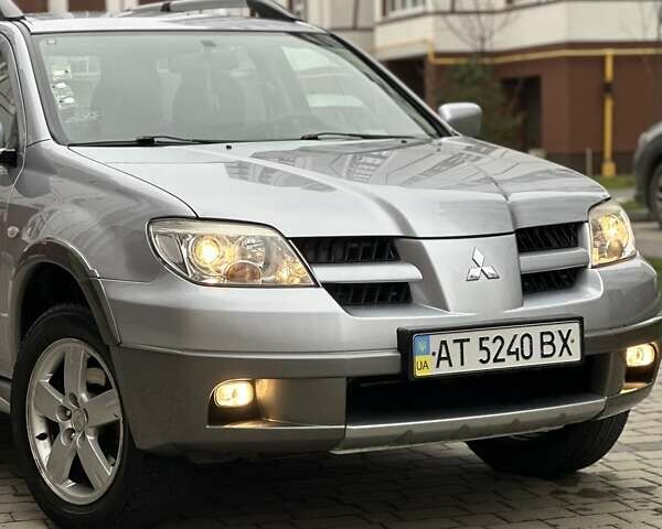 Сірий Міцубісі Аутлендер, об'ємом двигуна 2.4 л та пробігом 98 тис. км за 7199 $, фото 20 на Automoto.ua
