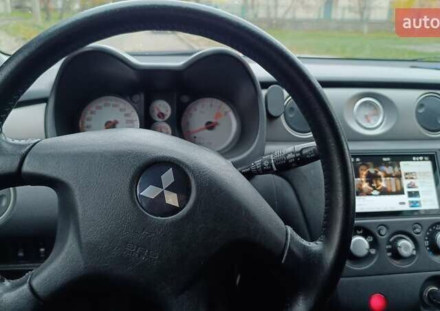 Сірий Міцубісі Аутлендер, об'ємом двигуна 2 л та пробігом 312 тис. км за 8300 $, фото 14 на Automoto.ua