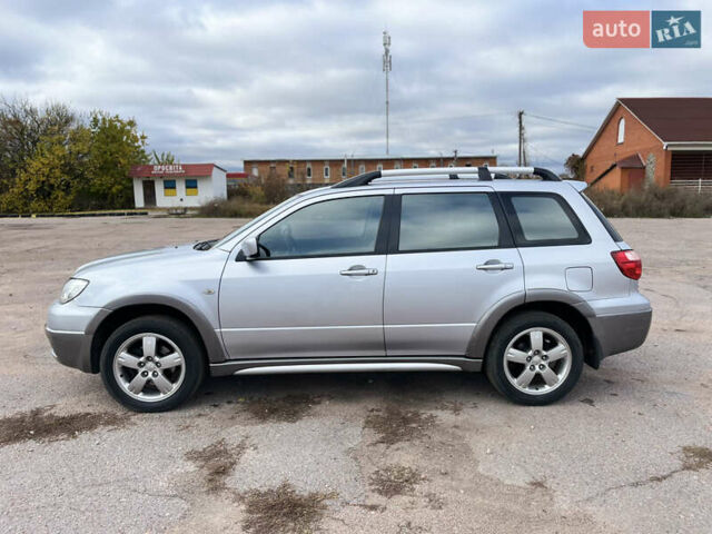 Серый Мицубиси Аутлендер, объемом двигателя 2.4 л и пробегом 264 тыс. км за 6300 $, фото 3 на Automoto.ua