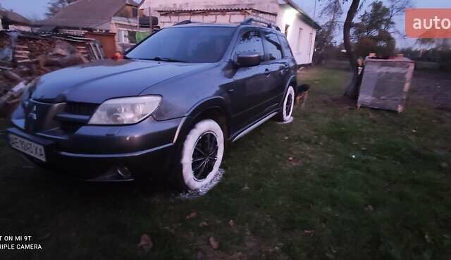 Сірий Міцубісі Аутлендер, об'ємом двигуна 2.38 л та пробігом 204 тис. км за 6500 $, фото 1 на Automoto.ua