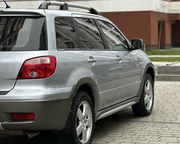 Сірий Міцубісі Аутлендер, об'ємом двигуна 2.4 л та пробігом 98 тис. км за 7199 $, фото 46 на Automoto.ua