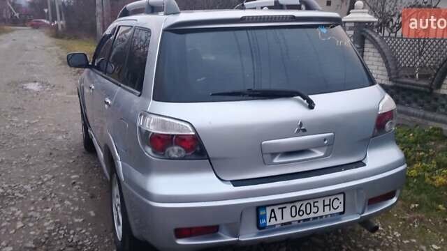 Серый Мицубиси Аутлендер, объемом двигателя 2.4 л и пробегом 261 тыс. км за 5700 $, фото 28 на Automoto.ua