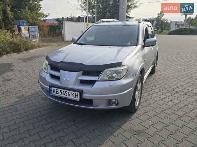 Серый Мицубиси Аутлендер, объемом двигателя 2.4 л и пробегом 243 тыс. км за 6999 $, фото 25 на Automoto.ua