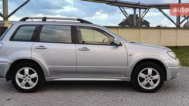 Серый Мицубиси Аутлендер, объемом двигателя 2.38 л и пробегом 228 тыс. км за 7900 $, фото 14 на Automoto.ua