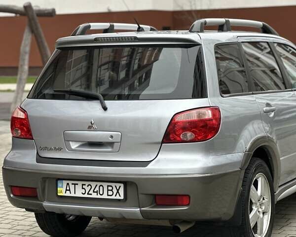 Сірий Міцубісі Аутлендер, об'ємом двигуна 2.4 л та пробігом 98 тис. км за 7199 $, фото 42 на Automoto.ua