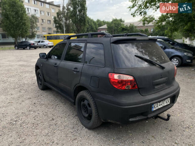 Серый Мицубиси Аутлендер, объемом двигателя 2 л и пробегом 270 тыс. км за 3600 $, фото 3 на Automoto.ua