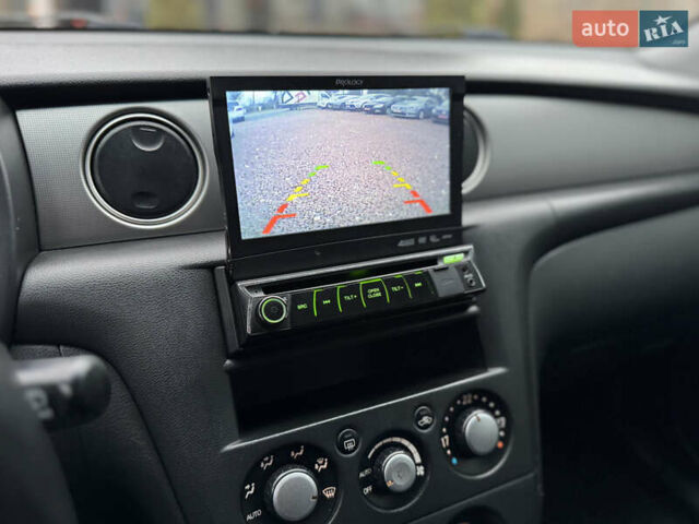 Серый Мицубиси Аутлендер, объемом двигателя 2.38 л и пробегом 204 тыс. км за 6990 $, фото 25 на Automoto.ua