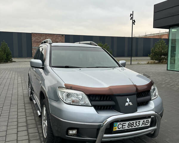 Серый Мицубиси Аутлендер, объемом двигателя 2.38 л и пробегом 180 тыс. км за 6000 $, фото 7 на Automoto.ua