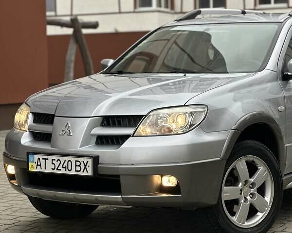 Сірий Міцубісі Аутлендер, об'ємом двигуна 2.4 л та пробігом 98 тис. км за 7199 $, фото 3 на Automoto.ua