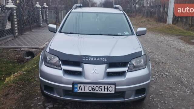 Серый Мицубиси Аутлендер, объемом двигателя 2.4 л и пробегом 261 тыс. км за 5700 $, фото 2 на Automoto.ua