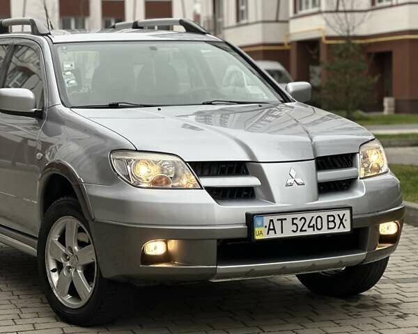 Сірий Міцубісі Аутлендер, об'ємом двигуна 2.4 л та пробігом 98 тис. км за 7199 $, фото 19 на Automoto.ua