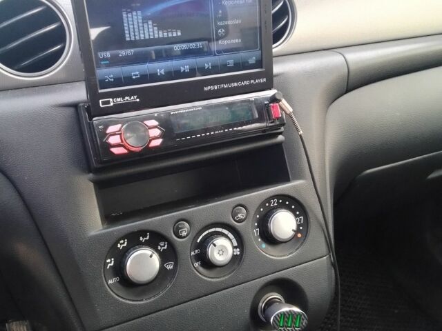 Серый Мицубиси Аутлендер, объемом двигателя 2 л и пробегом 154 тыс. км за 6500 $, фото 14 на Automoto.ua