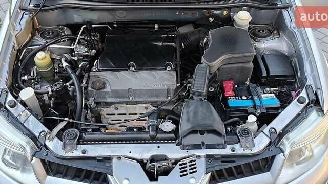 Серый Мицубиси Аутлендер, объемом двигателя 2.38 л и пробегом 228 тыс. км за 7900 $, фото 9 на Automoto.ua