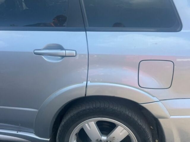 Серый Мицубиси Аутлендер, объемом двигателя 2.4 л и пробегом 220 тыс. км за 3369 $, фото 3 на Automoto.ua