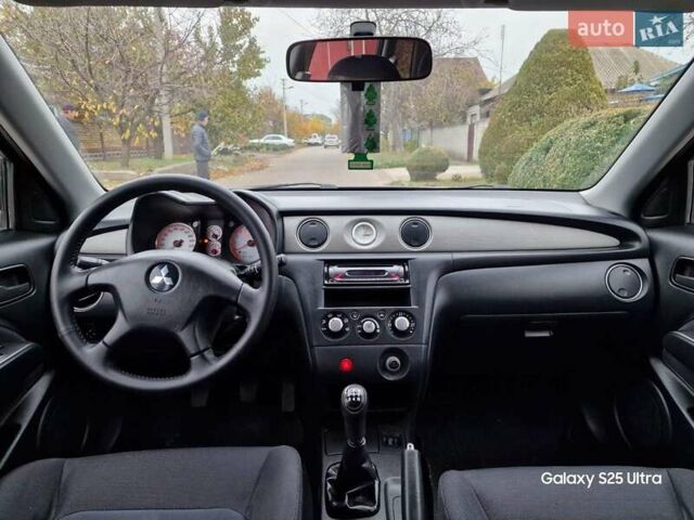 Серый Мицубиси Аутлендер, объемом двигателя 2 л и пробегом 240 тыс. км за 6300 $, фото 13 на Automoto.ua