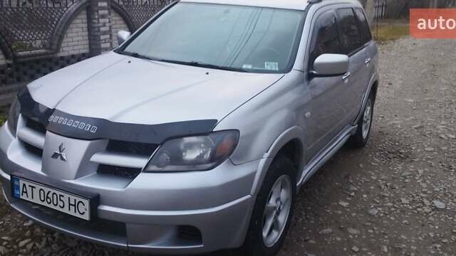 Серый Мицубиси Аутлендер, объемом двигателя 2.4 л и пробегом 261 тыс. км за 5700 $, фото 10 на Automoto.ua