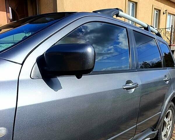 Сірий Міцубісі Аутлендер, об'ємом двигуна 2.4 л та пробігом 576 тис. км за 5800 $, фото 4 на Automoto.ua