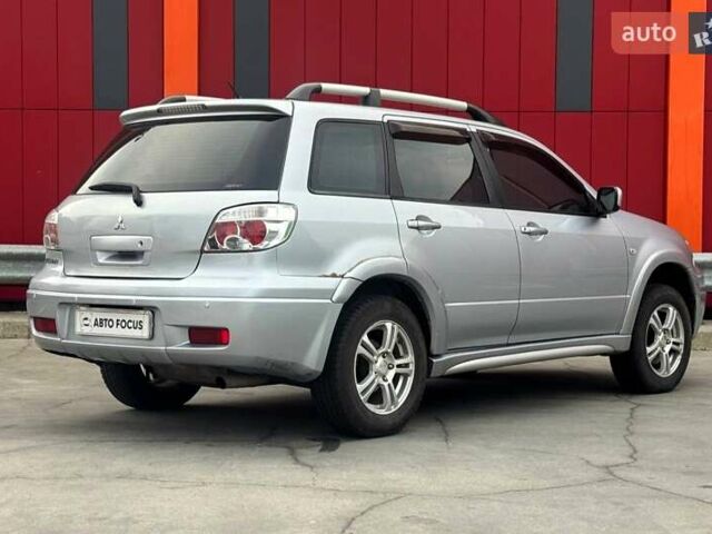 Серый Мицубиси Аутлендер, объемом двигателя 2.4 л и пробегом 245 тыс. км за 6790 $, фото 7 на Automoto.ua