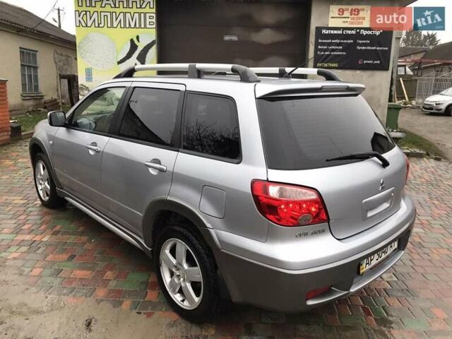 Сірий Міцубісі Аутлендер, об'ємом двигуна 2.4 л та пробігом 167 тис. км за 6400 $, фото 4 на Automoto.ua