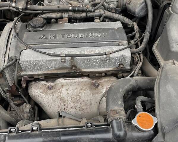 Сірий Міцубісі Аутлендер, об'ємом двигуна 2 л та пробігом 332 тис. км за 6200 $, фото 4 на Automoto.ua