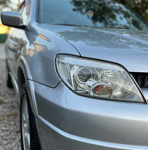 Серый Мицубиси Аутлендер, объемом двигателя 2.38 л и пробегом 238 тыс. км за 7450 $, фото 61 на Automoto.ua