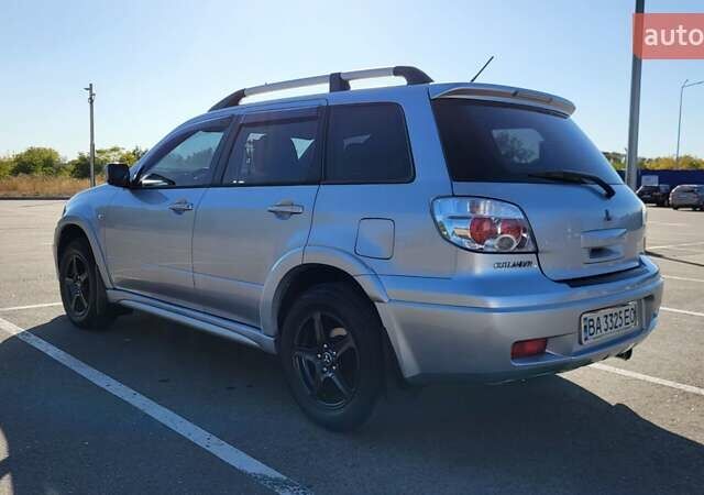 Сірий Міцубісі Аутлендер, об'ємом двигуна 2.4 л та пробігом 260 тис. км за 7300 $, фото 1 на Automoto.ua
