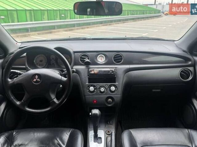 Серый Мицубиси Аутлендер, объемом двигателя 2.38 л и пробегом 245 тыс. км за 5390 $, фото 12 на Automoto.ua