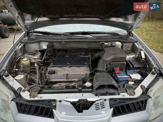 Серый Мицубиси Аутлендер, объемом двигателя 2.38 л и пробегом 238 тыс. км за 7450 $, фото 46 на Automoto.ua